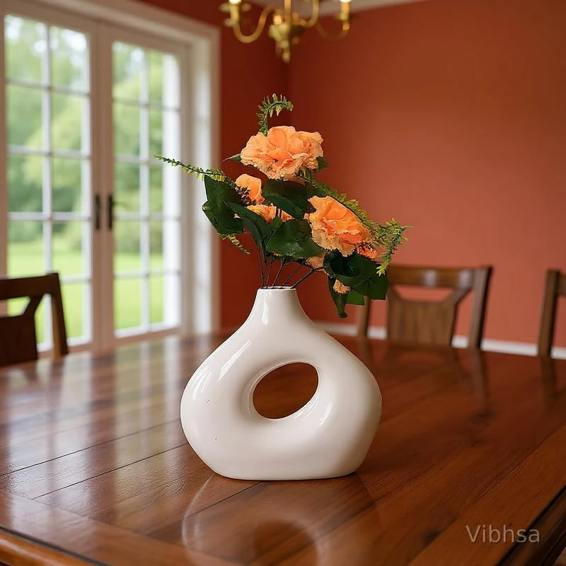 Vibhsa white ceramic donut vase styled with flowers